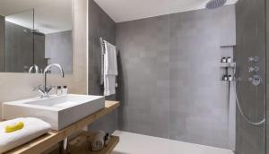a bathroom with a sink and a shower at Spacious Apartment in Tignes in Tignes +40 photos