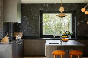 a kitchen with a sink and a window at Whimsy Woods - 14 Acre Millbrook Estate with Pool in Millbrook