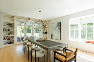 a dining room with a table and chairs at Whimsy Woods - 14 Acre Millbrook Estate with Pool in Millbrook +69 photos