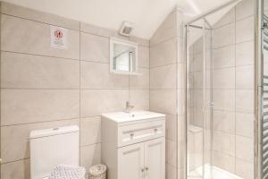 a bathroom with a toilet and a sink and a shower at 3 Bed in Blackburn oc-96386 in Blackburn +27 photos