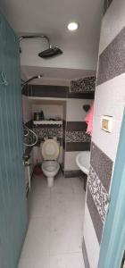 a small bathroom with a toilet and a sink at Dar EMNA in Kairouan