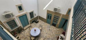 an overhead view of a table and chairs in a building at Dar EMNA in Kairouan