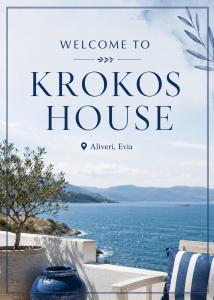 a sign that reads welcome to krovos house with a view of the ocean at KROKOS HOUSE in Aliveri
