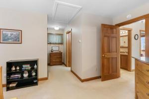 a living room with a skylight at Serene waterfront home w/ a dock, large deck & amazing views! in Dyer Cove
