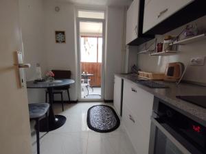a kitchen with a counter and a table in it at Sky Vista in Železnička Stanica Tuzla