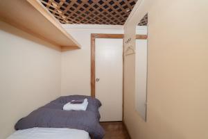 
Кровать или кровати в номере Chelsea Cabins
