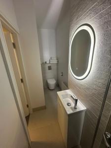 a bathroom with a sink and a mirror at The Sliding Rock Inn in Galway +23 photos