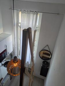 an overhead view of a staircase in a kitchen with a window at Passage Foch centre historique in Perpignan +11 photos