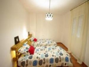 Cama o camas de una habitación en Livingtarifa Apartamento El Nido
