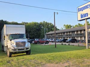 a semi truck parked in front of a parking lot at Regency Inn in Jewett +37 photos