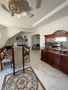 a large living room with a vanity and a mirror at Dar Souleyman in Midoun