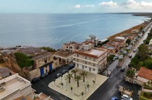 an aerial view of a town next to the ocean at Hotel Noto Marina Scirocco & SPA in Noto Marina