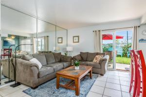 a living room with a couch and a table at Carpinteria Shores CS 103 in Carpinteria