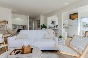 a white living room with a white couch at Bella Surf in Avila Beach +39 photos