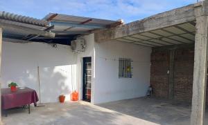 a garage with awning on the side of a building at Refugio de Paso Ezeiza in Ezeiza