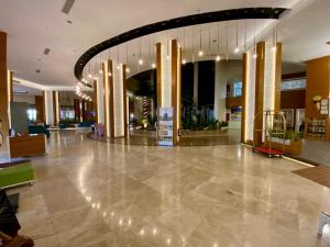 a lobby of a hotel with a large hall with lights at Kule Hotel&Spa Gaziantep in Şahinbey