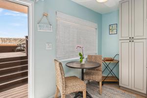 a dining room with a table and chairs at Carpinteria Shores CS 110 in Carpinteria