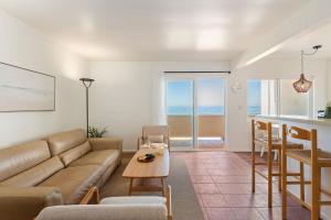 a living room with a couch and a table at Carpinteria Shores CS 210 in Carpinteria