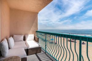 a balcony with a couch and a view of the beach at Carpinteria Shores CS 312 in Carpinteria