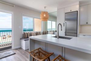 a kitchen with a view of the ocean at Carpinteria Shores CS 312 in Carpinteria