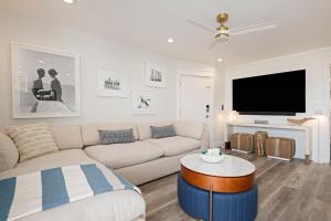 a living room with a couch and a tv at Carpinteria Shores CS 109 in Carpinteria