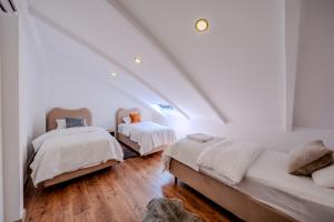 a bedroom with two beds in a attic at Luxury Forest Villas with Private Pool in Antalya +123 photos
