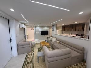 a living room with a couch and a table at الشروق in Al Baha