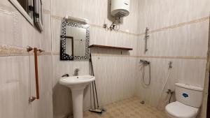 a bathroom with a sink and a toilet at Adelhouse in Saint-Louis +17 photos
