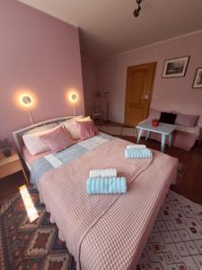 a bedroom with a large bed with two pillows on it at Nensi in Mostar