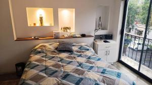 a bedroom with a bed and a mirror and a window at Lake side Luxury Duplex ! in Jurica