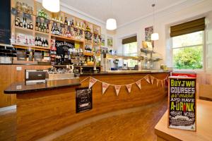 a bar with a banner hanging from the counter at YHA Penzance in Penzance