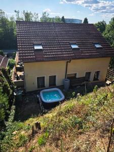 a house with a swimming pool in the yard at Villa Slnava in Banka