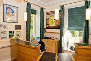 an office with a desk and a table and a window at YHA Penzance in Penzance