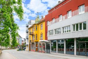 a row of buildings on a city street at Voy Stays Molde sentrum in Molde