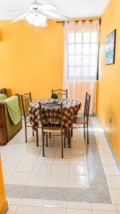 a dining room with a table and chairs at Villa Bonita Torre 16 in Cozumel