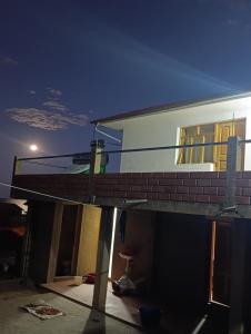 a house under construction at night at Kusikuy Wasy Lodge in Puno