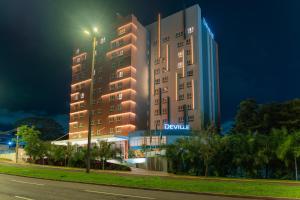 a rendering of a hotel at night at Deville Prime Campo Grande in Campo Grande
