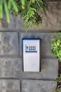 a microwave oven embedded in a stone wall at Gästezimmer Hönow bei Berlin in Hoppegarten