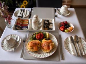 a white table with plates of food on it at The Beaumont in Sittingbourne