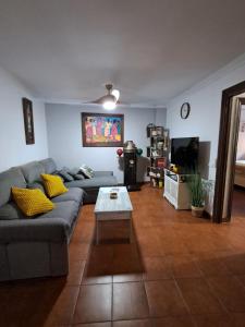 a living room with a couch and a coffee table at Casa La Tapita in Marbella