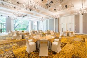 a banquet hall with tables and chairs and chandeliers at InterContinental Hua Hin Resort by IHG in Hua Hin +213 photos