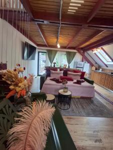 a large room with a bed and a couch at Casa Anne Boutique in Braşov +158 photos