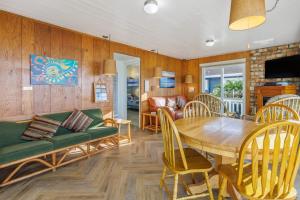 a living room with a table and a couch at Coastal Coziness in Cayucos