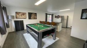 a room with a pool table in a room at Remodeled, Spacious, Modern Retreat 5 BR, 3BA, 2KIT in Shoreline