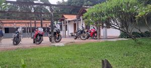a group of motorcycles parked in front of a building at Krushikoota Homestay in Sringeri
