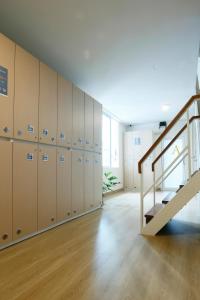 an empty locker room with lockers and a staircase at Wonderful Bangkok in Bangkok