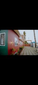 a house with a flag painted on the side of it at Corniche inn river view villa 2 BHK in Kāsaragod