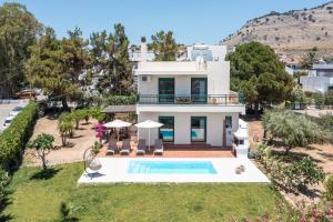 an aerial view of a villa with a swimming pool at Villa Calliope Lardos in Lartos