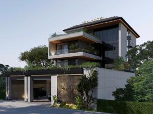 a building with a sign that reads marriott at Mia Hotel in Ga Trảng Bôm