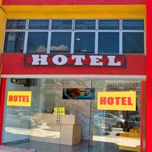 a hotel sign on the front of a building at Georgetown New Wave Hotel in George Town